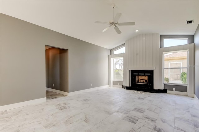 unfurnished living room with ceiling fan and vaulted ceiling