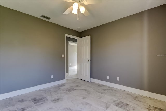 spare room with ceiling fan