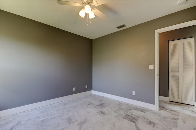 empty room with ceiling fan