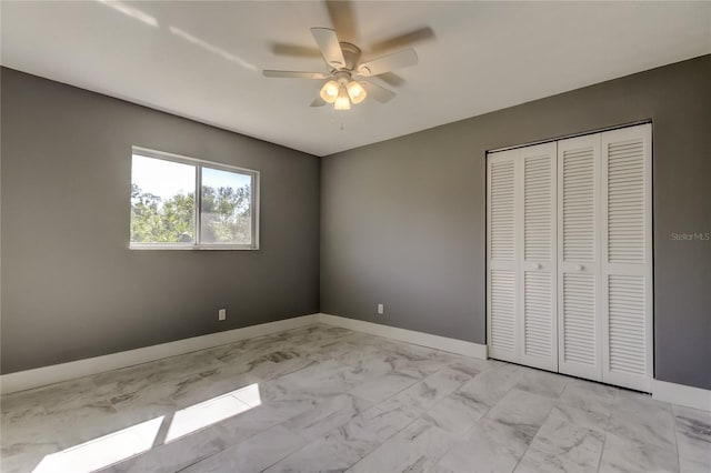 unfurnished bedroom featuring a closet and ceiling fan