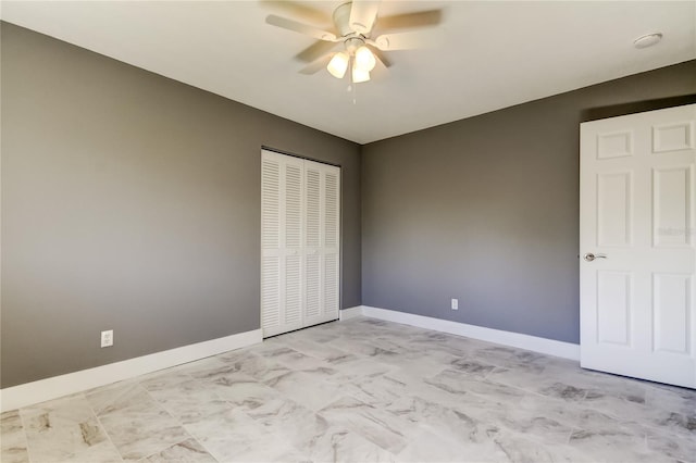 unfurnished bedroom featuring a closet and ceiling fan