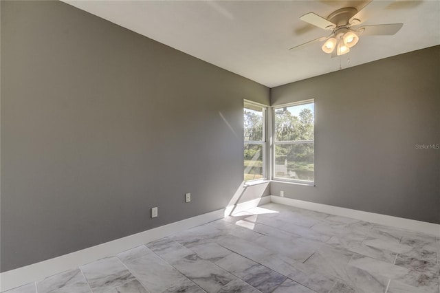 spare room with ceiling fan