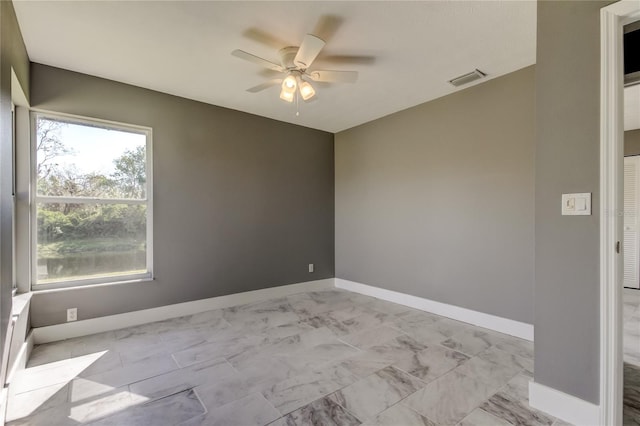 empty room featuring ceiling fan