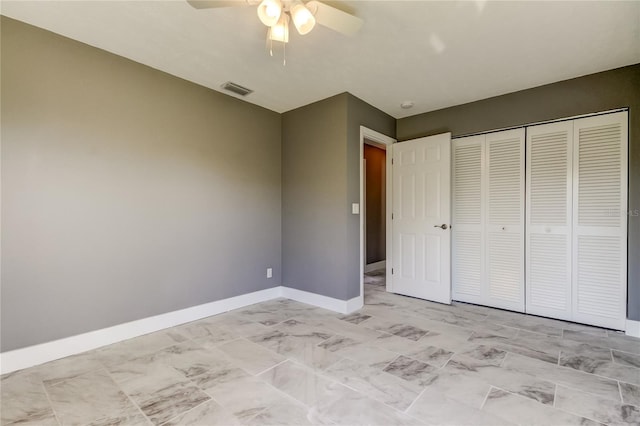 unfurnished bedroom with a closet and ceiling fan