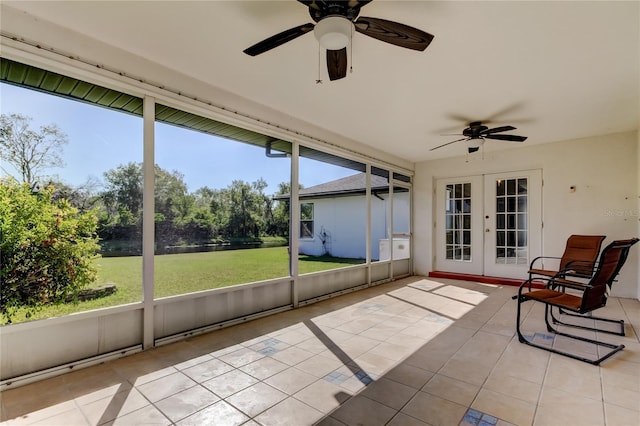 unfurnished sunroom with french doors and ceiling fan