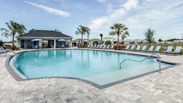 view of swimming pool with a patio