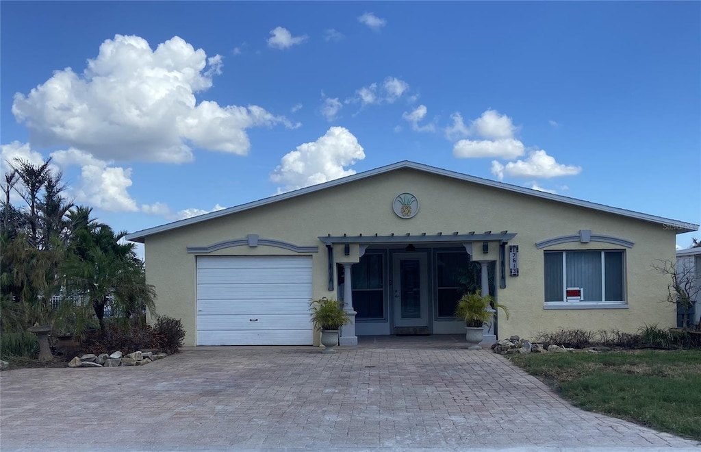 ranch-style house featuring a garage