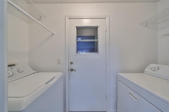 laundry area featuring independent washer and dryer