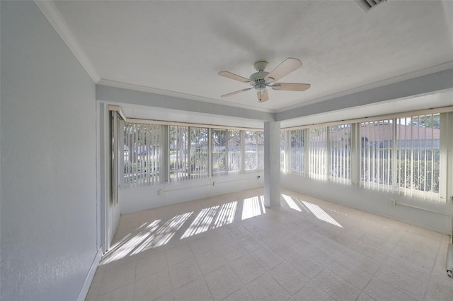 unfurnished sunroom featuring ceiling fan