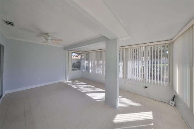 unfurnished sunroom with plenty of natural light and ceiling fan