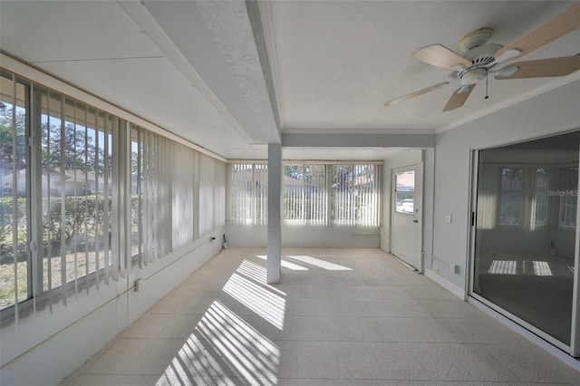 sunroom with ceiling fan and plenty of natural light