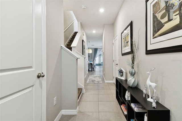 corridor with light tile patterned floors