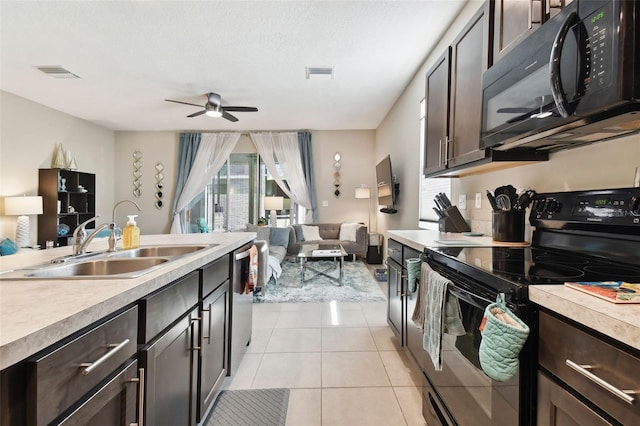 kitchen with black appliances, sink, ceiling fan, light tile patterned floors, and dark brown cabinets