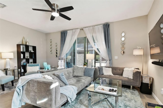 tiled living room featuring ceiling fan