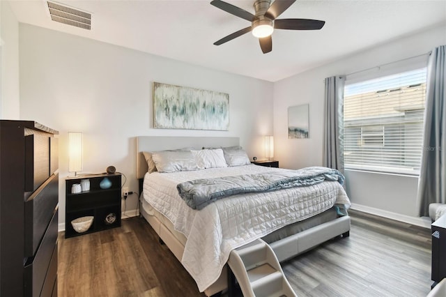 bedroom featuring ceiling fan and dark hardwood / wood-style floors