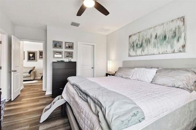 bedroom with ceiling fan and wood-type flooring