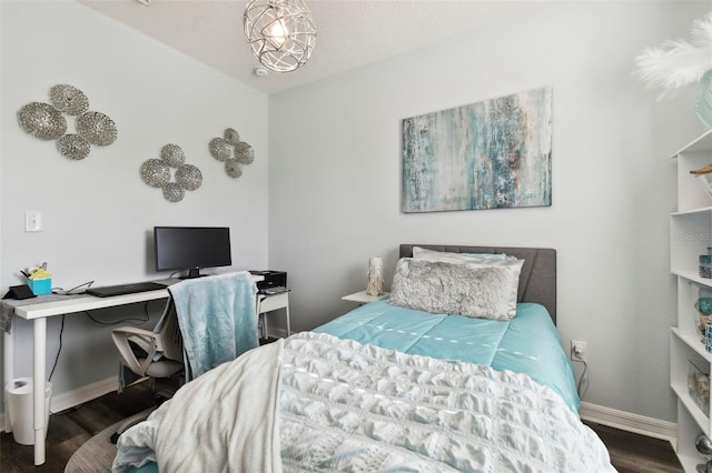 bedroom with dark hardwood / wood-style floors