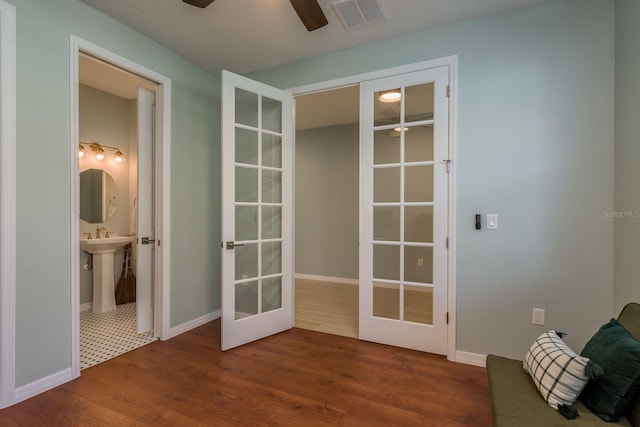 doorway to outside featuring dark hardwood / wood-style floors, french doors, and ceiling fan