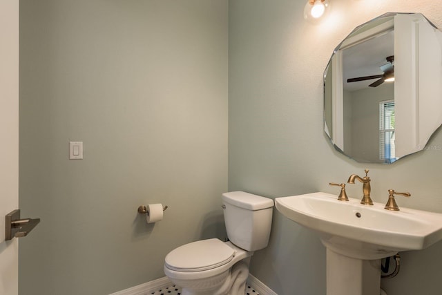 bathroom with ceiling fan, sink, and toilet