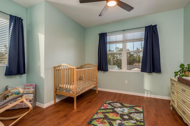 bedroom with wood-type flooring and ceiling fan