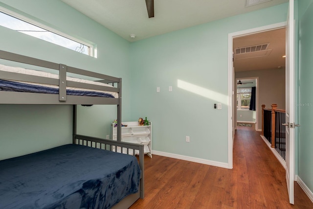 bedroom with hardwood / wood-style flooring and ceiling fan