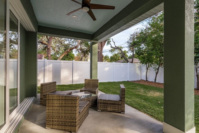 view of patio / terrace featuring ceiling fan