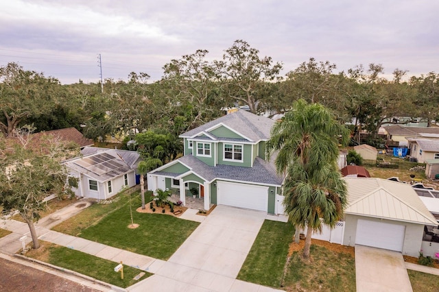 view of front of house with a garage and a front yard