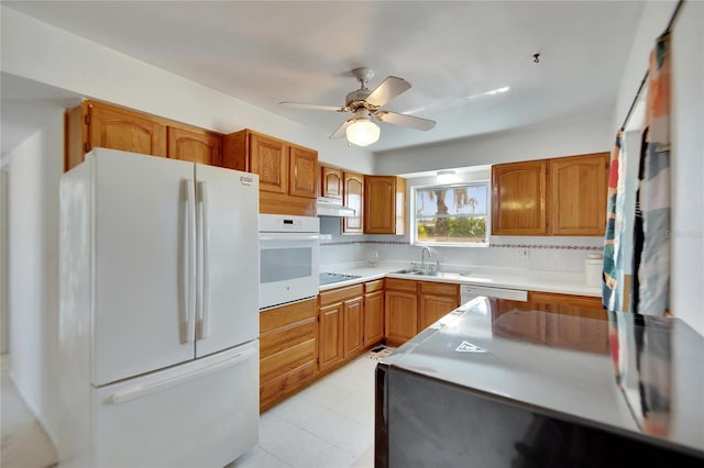 kitchen featuring backsplash, white appliances, ceiling fan, sink, and light tile patterned floors