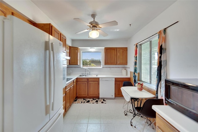 kitchen with ceiling fan, sink, backsplash, white appliances, and light tile patterned floors