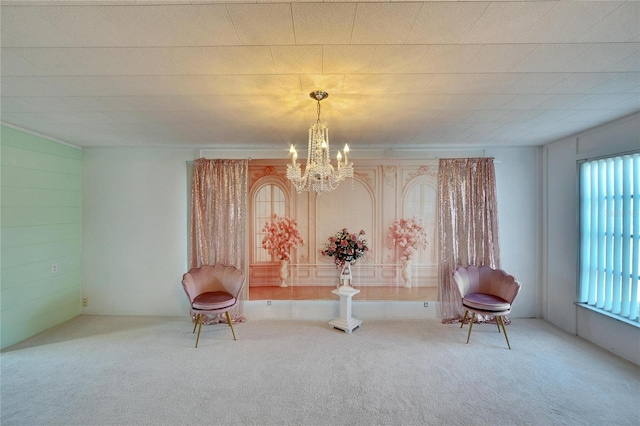 unfurnished room featuring carpet flooring and a notable chandelier