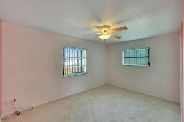 carpeted empty room with ceiling fan