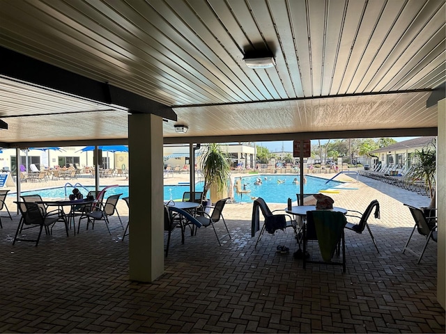 view of swimming pool with a patio area