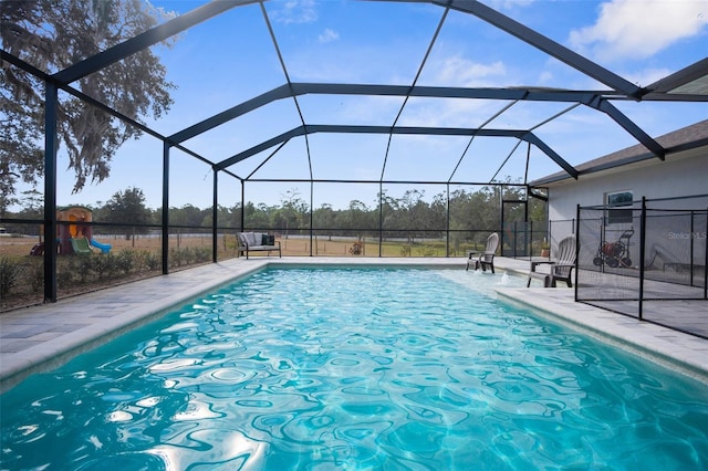 pool featuring a lanai and a patio