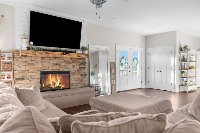 living room with a fireplace and wood finished floors