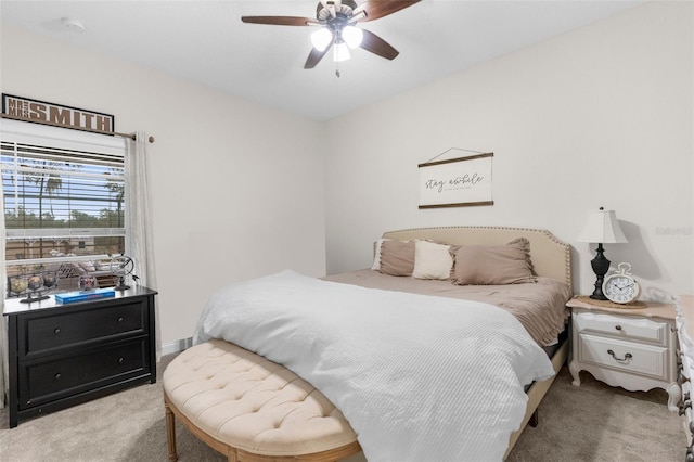 bedroom with ceiling fan and carpet flooring