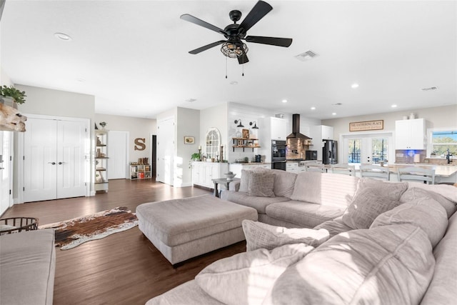 living room with visible vents, french doors, wood finished floors, and recessed lighting