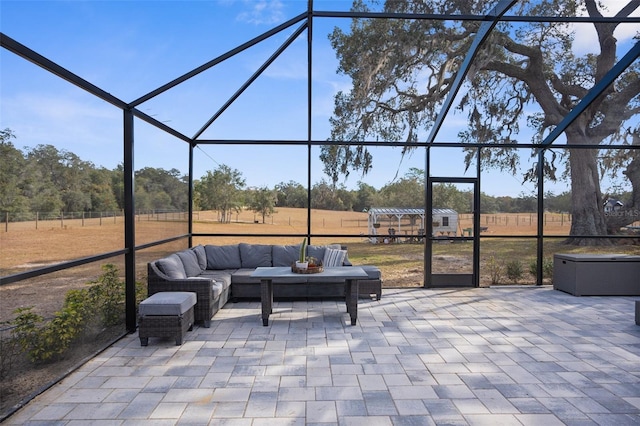 view of patio / terrace featuring glass enclosure and outdoor lounge area