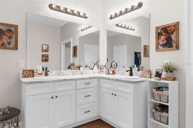 bathroom featuring double vanity and a sink