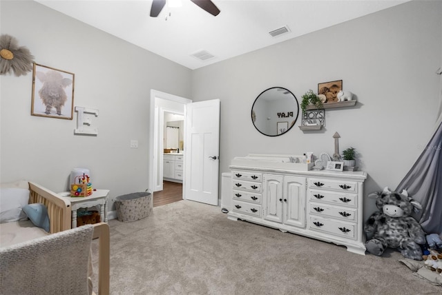 bedroom featuring light carpet, visible vents, and a ceiling fan