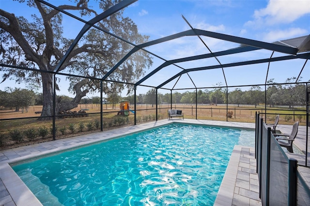 outdoor pool featuring a lanai and a patio