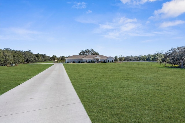 exterior space featuring a front yard and a rural view