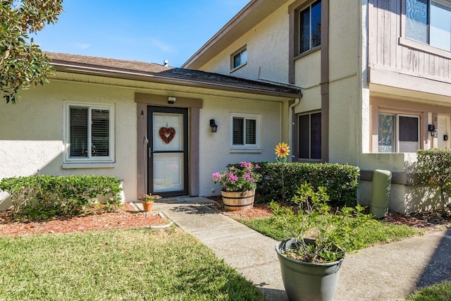 property entrance with a yard