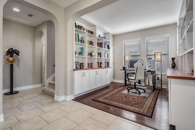 office with light wood-type flooring