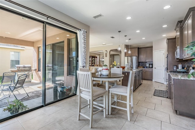 tiled dining area with sink