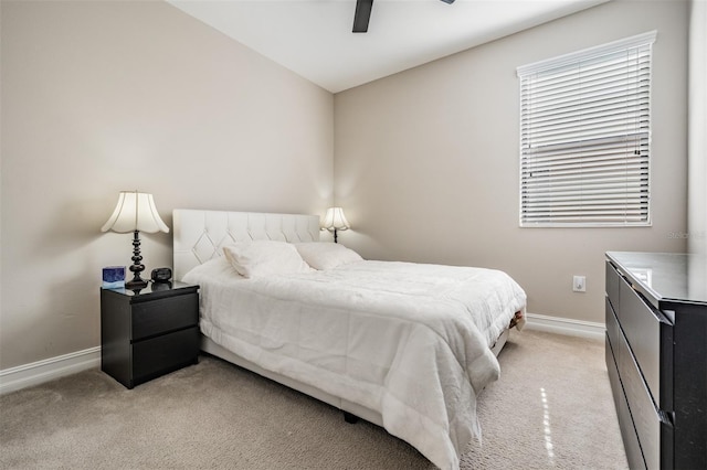 bedroom with light colored carpet and ceiling fan