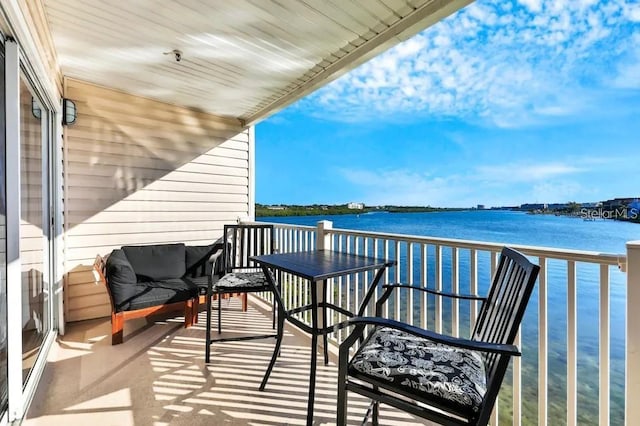 balcony featuring a water view