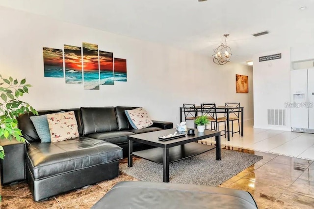 19811 Gulf Blvd Unit 102, Indian Shores, FL 33785 - living room with a notable chandelier