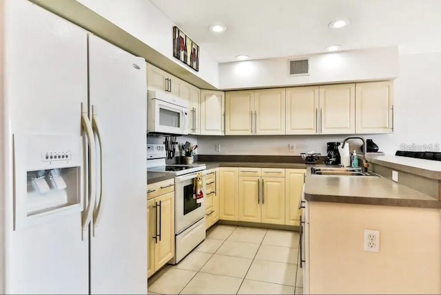 19811 Gulf Blvd Unit 102, Indian Shores, FL 33785 - kitchen with sink, light tile patterned floors, and white appliances