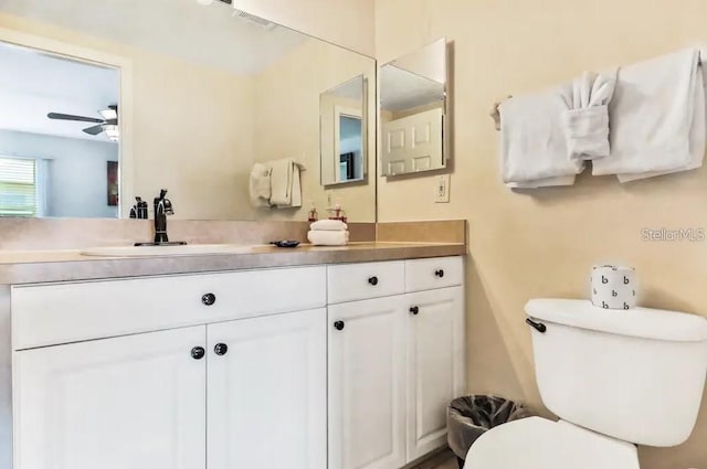 19811 Gulf Blvd Unit 102, Indian Shores, FL 33785 - bathroom with vanity, toilet, and ceiling fan