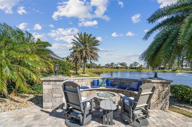 view of patio with a water view